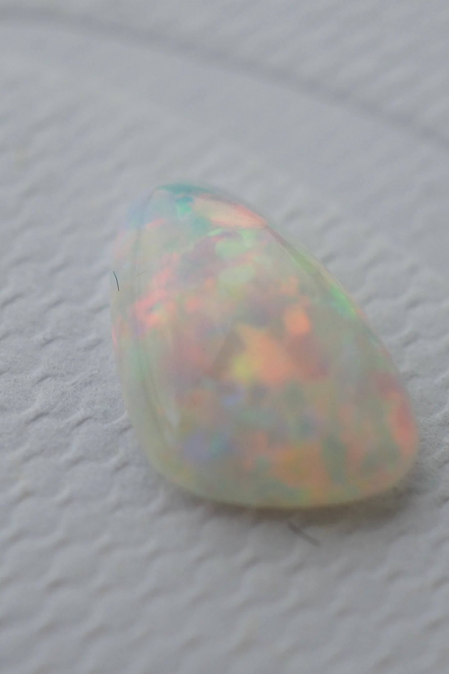 White Opal Filled with Pink Flashes
