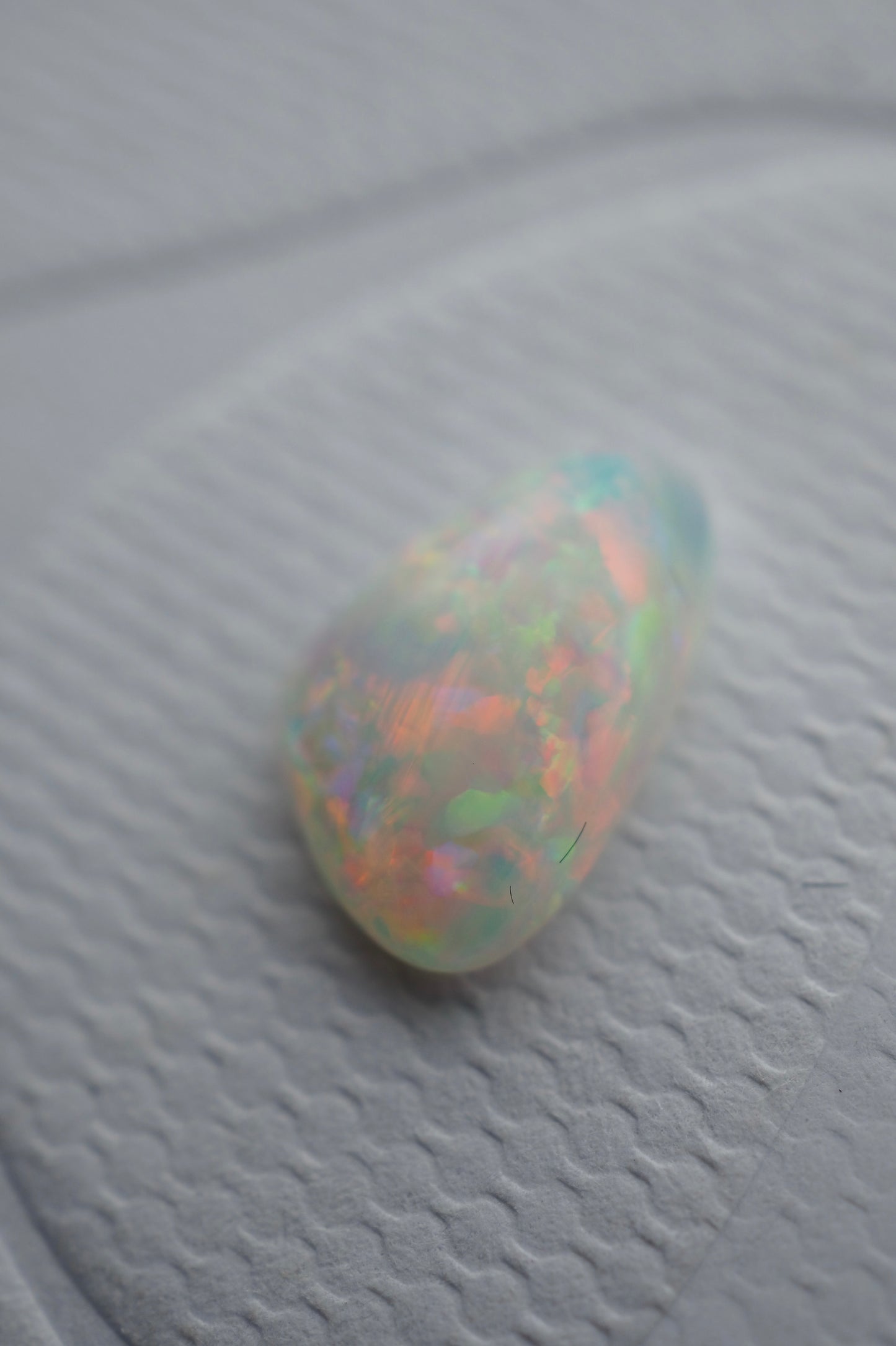 White Opal Filled with Pink Flashes