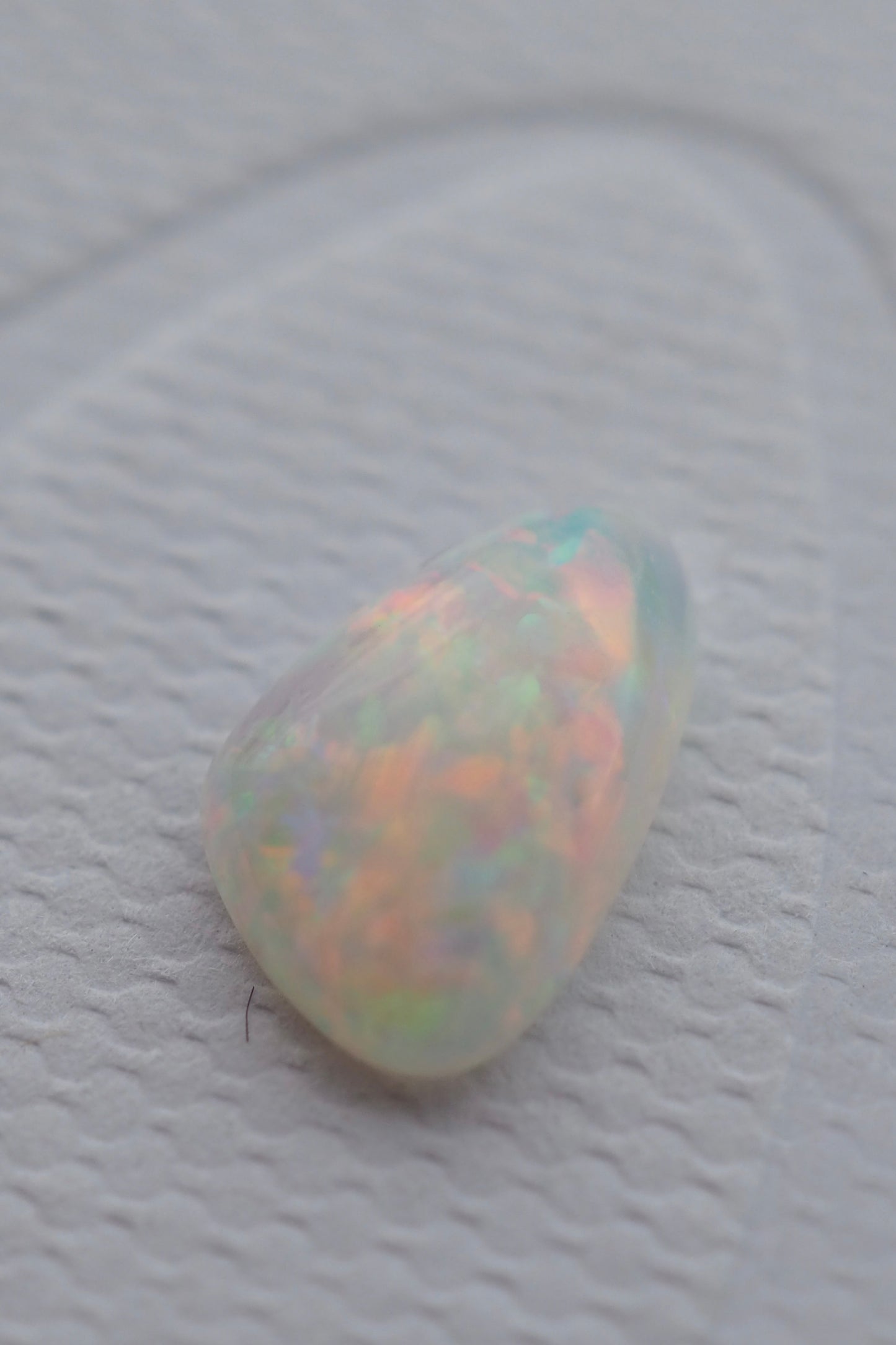 White Opal Filled with Pink Flashes